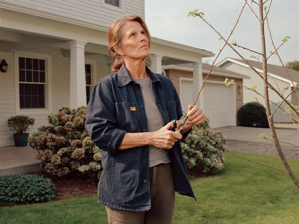 Illustrative scene of a landscaper tending a garden